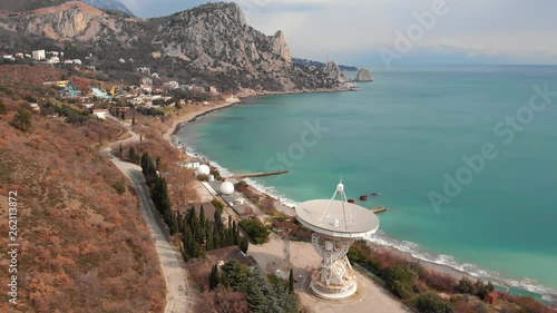 Radio telescope RT-22 in Simeiz Observatory, Crimea. Big white satellite dish antenna on sea coast for astronomy research, aerial view photo