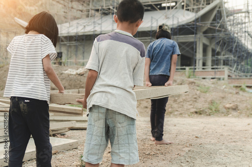 Children working at construction site for world day against child labour concept: