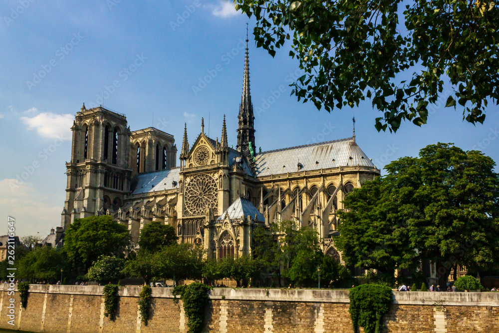 A side view from the Seine river of Notre Dame de Paris cathedral