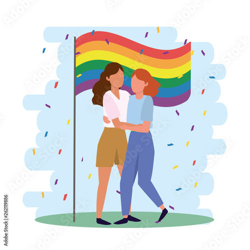 women couple with rainbow flag to lgbt parade