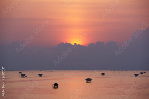Sunrise behind the clouds over the gulf of Thailand
