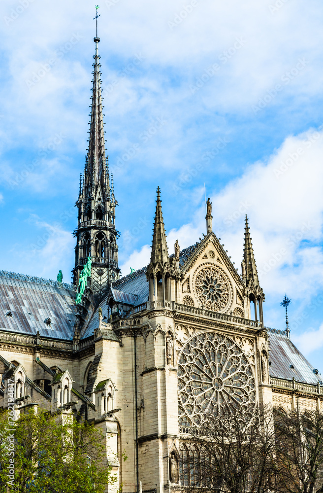 Spire and Southern rose window of Cathedral Notre Dame de Paris Spire and Southern rose window of Cathedral Notre Dame de Paris