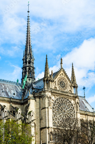 Spire and Southern rose window of Cathedral Notre Dame de Paris