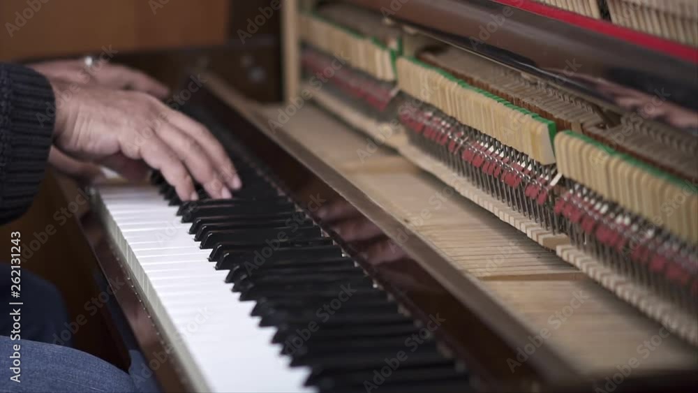 Musician plays open piano, Slow Motion Top View Medium shot with shallow depth of field Musician plays open piano, Slow Motion Top View Medium shot with shallow depth of field