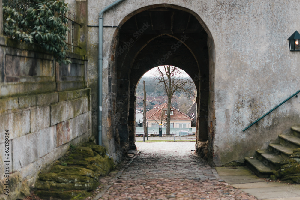 Medieval european castle arch with view on street