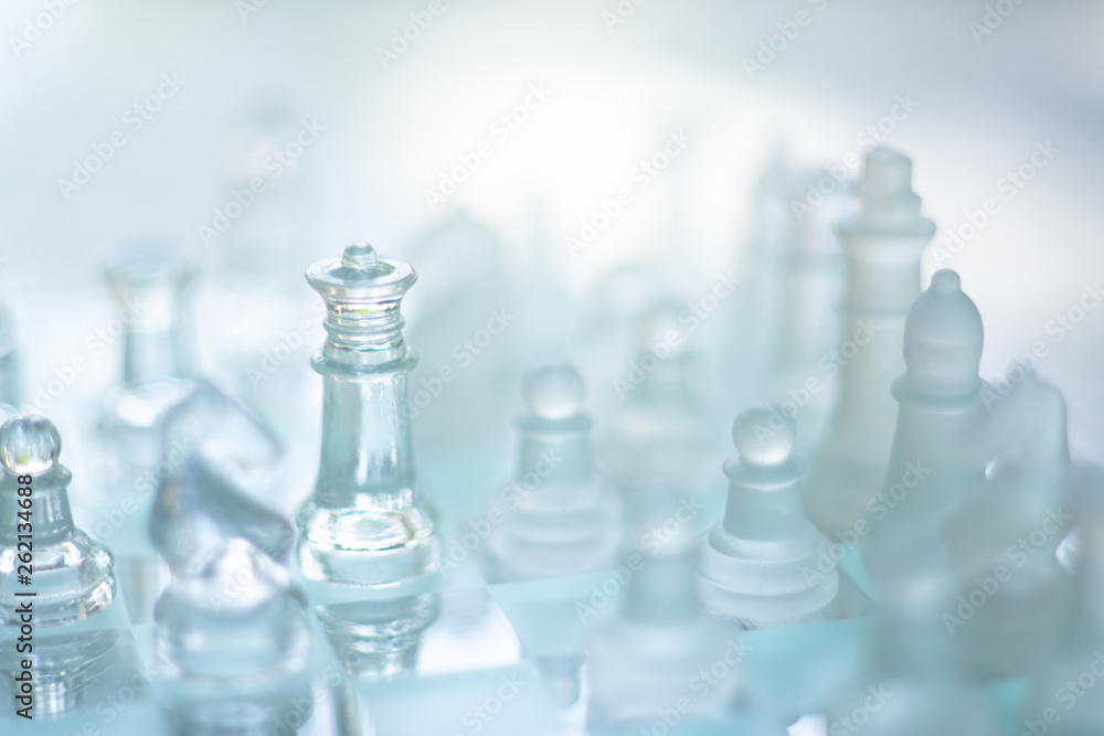 Chess board game made of glass, business competitive concept Chess board game made of glass, business competitive concept