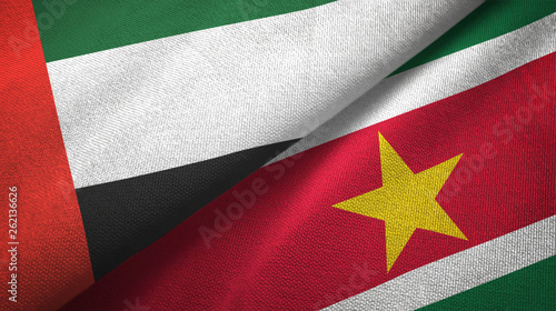 United Arab Emirates and Suriname two flags textile cloth, fabric texture