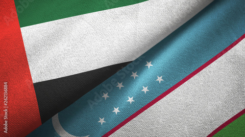 United Arab Emirates and Uzbekistan two flags textile cloth, fabric texture