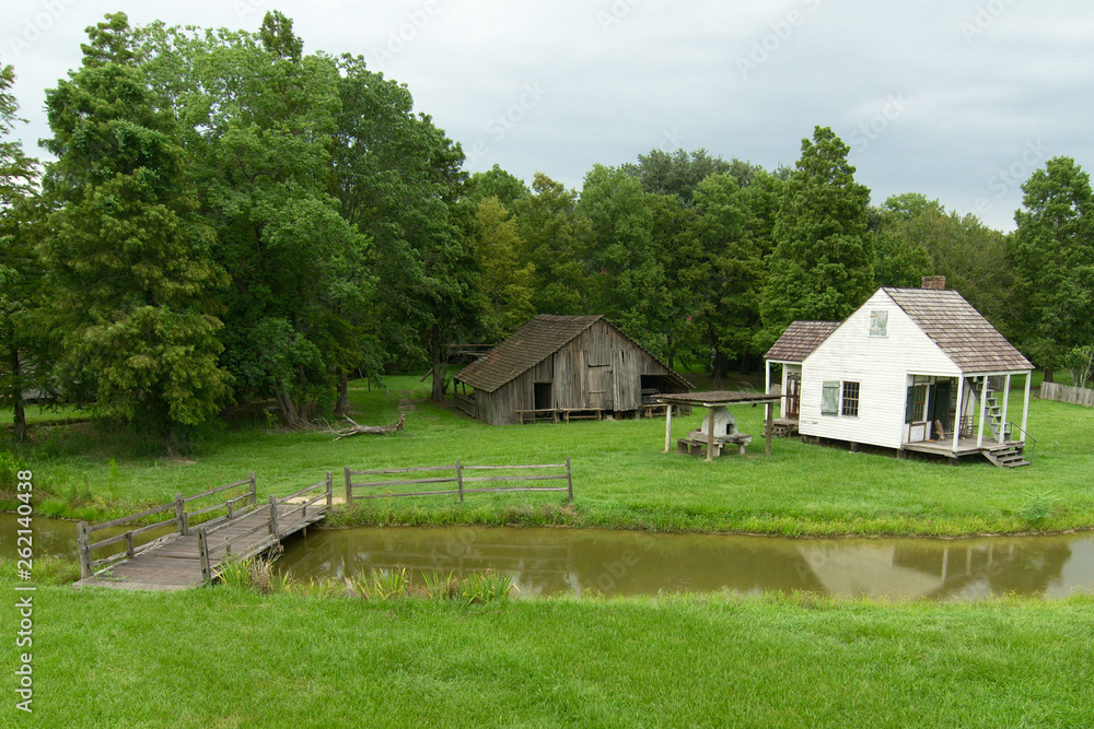 Cabin and barn at LSU Rural Life Museum, an outdoor museum of Louisiana history, Baton Rouge, Louisiana. Cabin and barn at LSU Rural Life Museum, an outdoor museum of Louisiana history, Baton Rouge, Louisiana.
