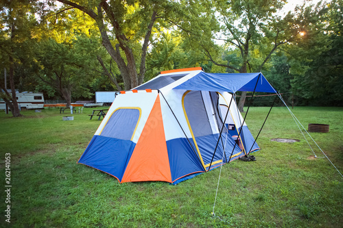 Blue and orange camping tent on a camping site