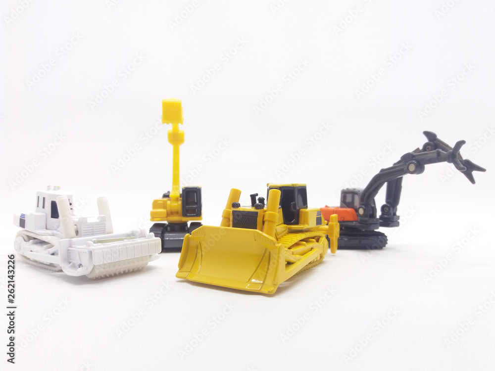 Building Construction Vehicle Toys Models in White Isolated Background Building Construction Vehicle Toys Models in White Isolated Background