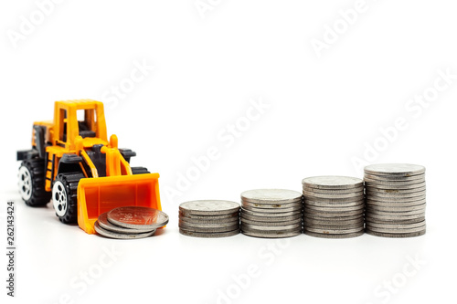 A yellow toy bulldozer with...