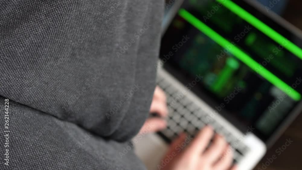 Anonymous Hooded Hacker Programming in Computer Console Breaking Password Anonymous Hooded Hacker Programming in Computer Console Breaking Password