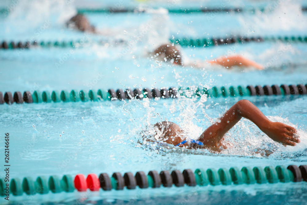 Children swimming in a freestyle race