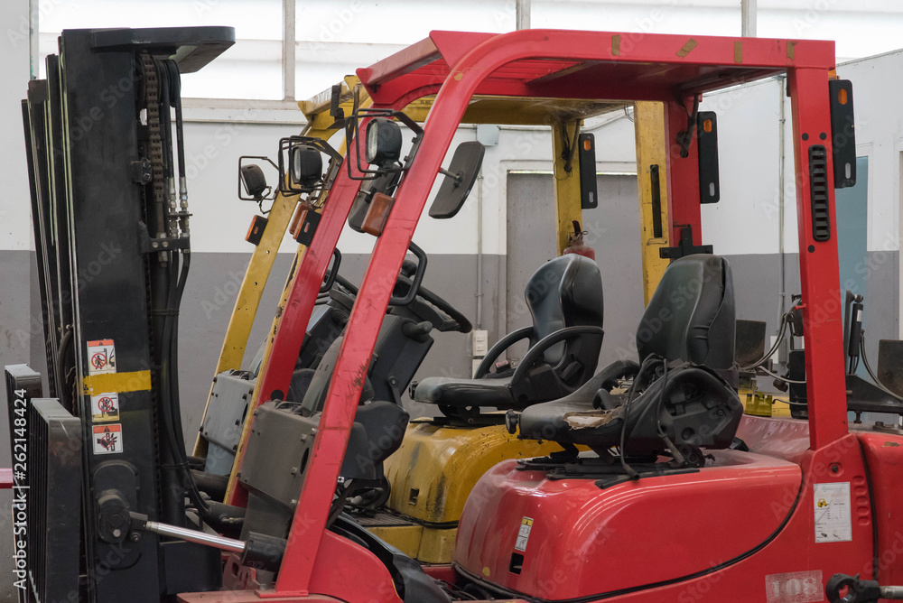 Fototapeta premium Forklifts in warehouse