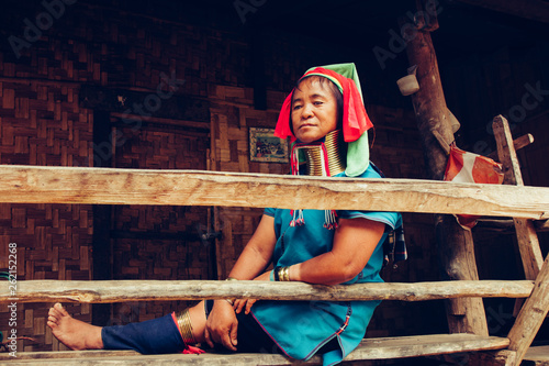 Long Neck Woman wearing at traditional costume. Tribal village Thailand. photo