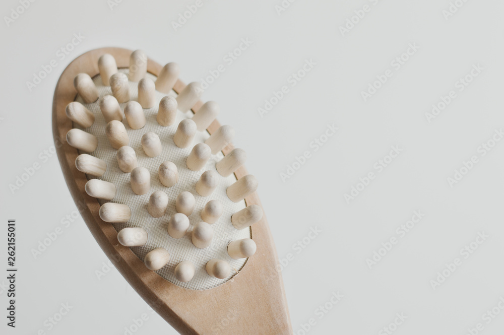 Wooden brush for anticellulite treatment. Beauty tool for self massage Wooden brush for anticellulite treatment. Beauty tool for self massage