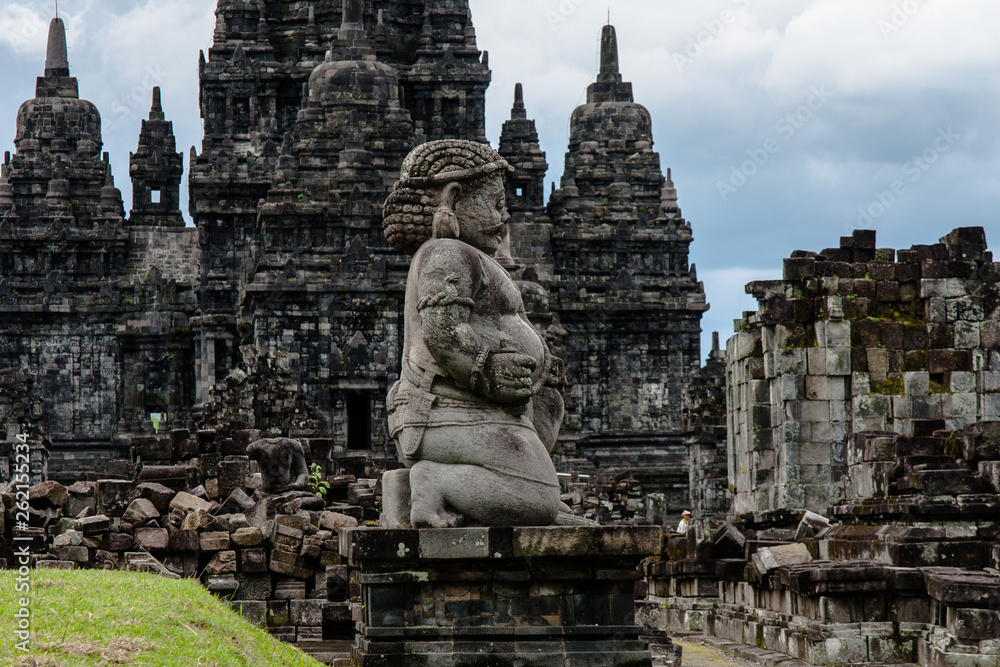 A view of Candi Sewu (Sewu Temple) with a dvarapala (guard) at the front