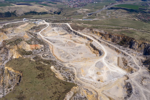Aerial drone view of a limestone quarry, open pit mine