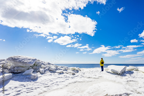 Saint-Petersburg. Shore of the Gulf of Finland in spring. Ice floes , sun and blue water of the Baltic sea.