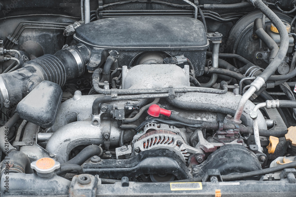 The device components of the car engine in the engine compartment The device components of the car engine in the engine compartment
