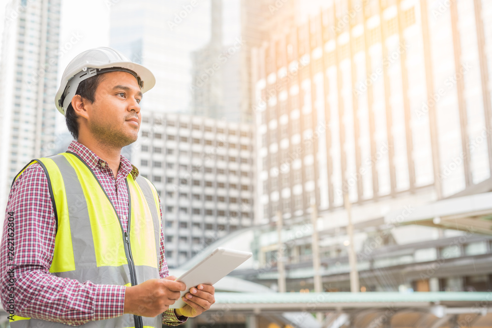 Young civil engineer and construction building background. Young civil engineer and construction building background.