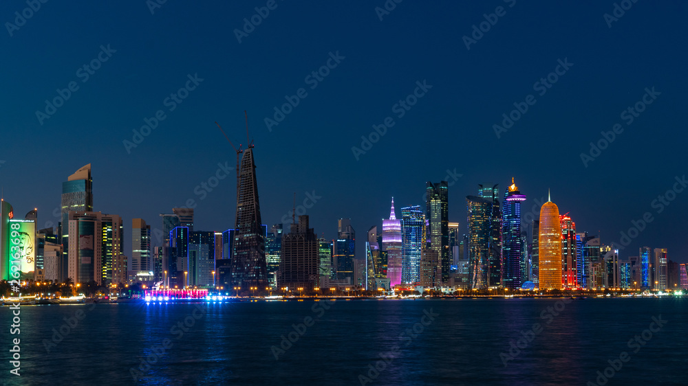 Fototapeta premium Doha Qatar skyline cityscape with skyscrapers at night