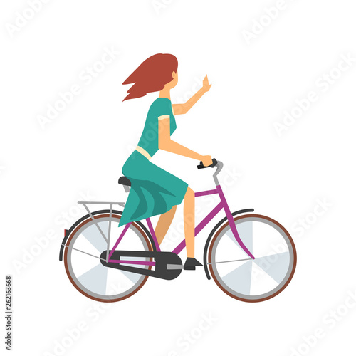 Fototapeta Naklejka Na Ścianę i Meble -  Young Woman in Green Dress Riding Bike and Waving Her Hand, Female Cyclist Character on Bicycle Vector Illustration