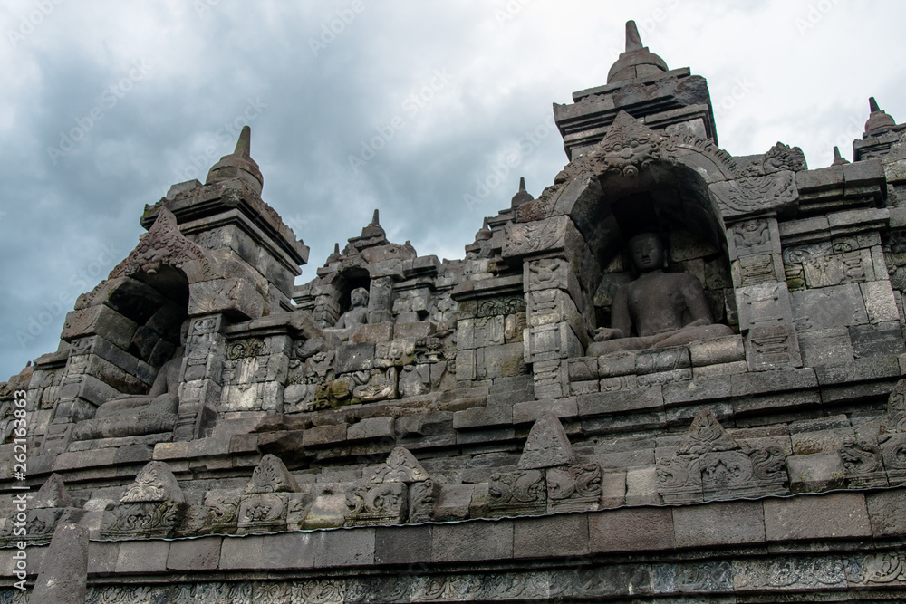 Statues of seated Buddha in the niches of the Borobudur Temple, Jogjakarta