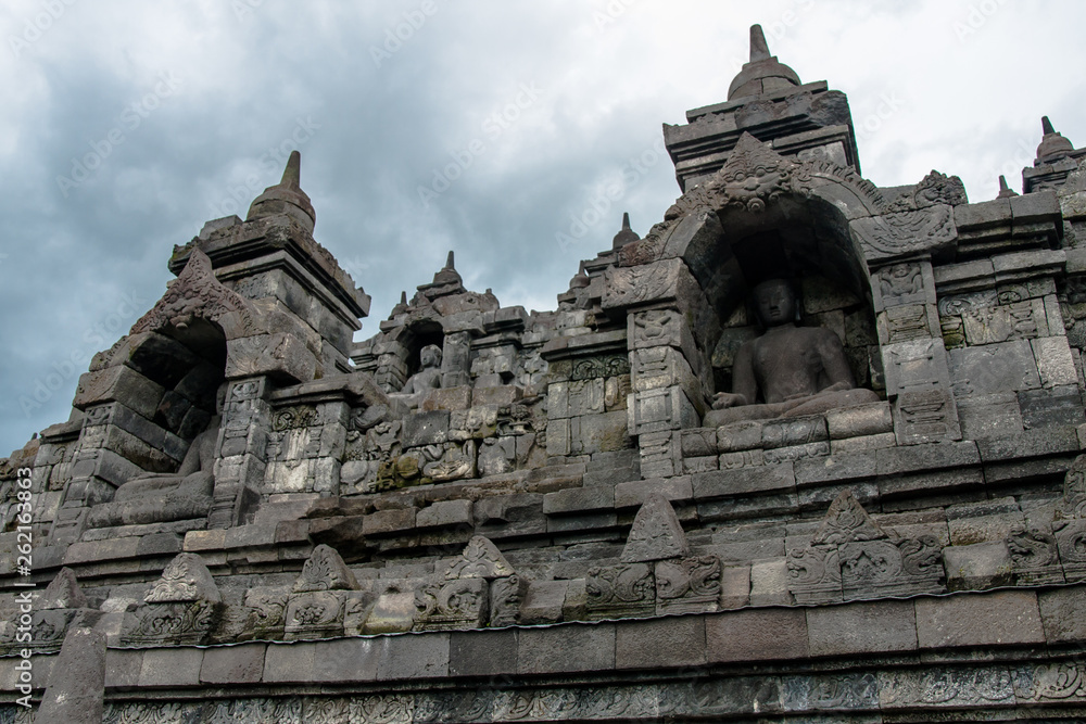 Statues of seated Buddha in the niches of the Borobudur Temple, Jogjakarta Statues of seated Buddha in the niches of the Borobudur Temple, Jogjakarta