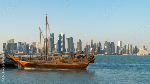 Doha Qatar skyline with traditional Qatari Dhow boats in the harbor © CanYalicn