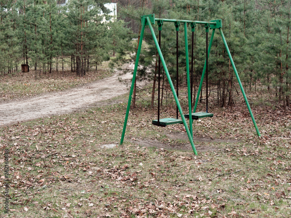 children's swing in the recreation area in the forest children's swing in the recreation area in the forest
