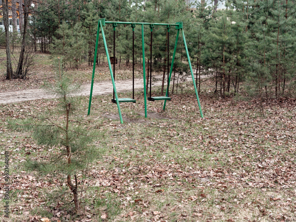 children's swing in the recreation area in the forest children's swing in the recreation area in the forest