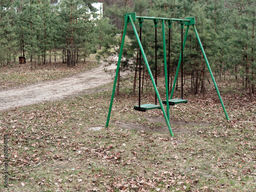 children's swing in the recreation area in the forest
