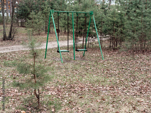 children's swing in the recreation area in the forest