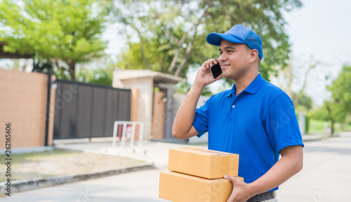 Blue Delivery man and parcel box package.