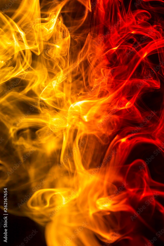 Fototapeta premium Colored smoke on black background