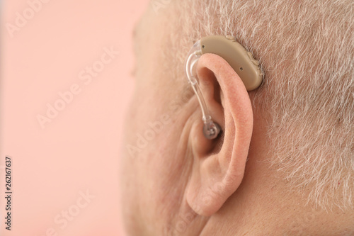 Senior man with hearing aid...