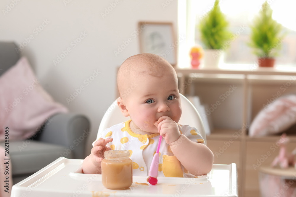 Portrait of little girl with tasty baby food at home Portrait of little girl with tasty baby food at home
