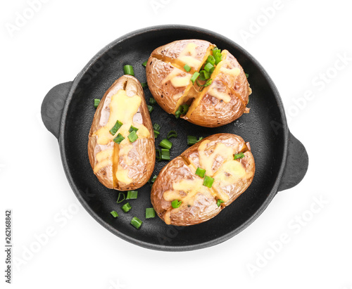 Frying pan with tasty baked potato on white background
