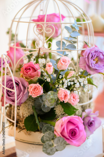 floral arrangement of flowers, bird cage with flowers