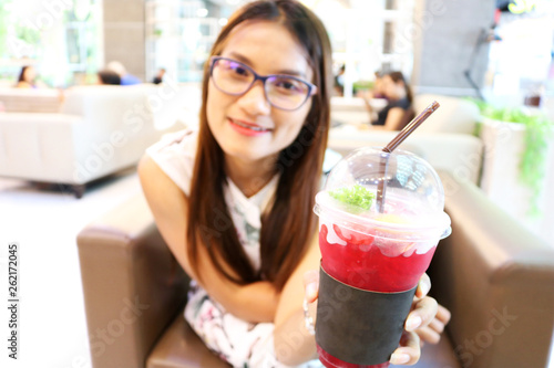 young woman eating fruit salad