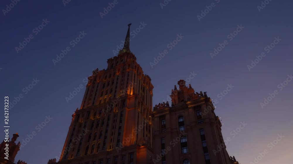 Beautiful Art Deco historic building. It's getting dark, orange facade ...