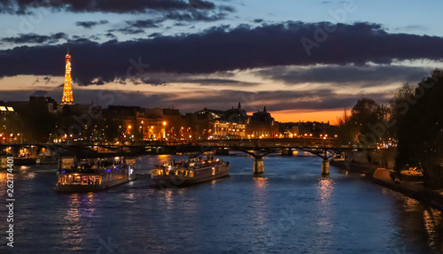 Beautiful night Paris  sparkling tower  bridge over the River Seine and touristic boats. France
