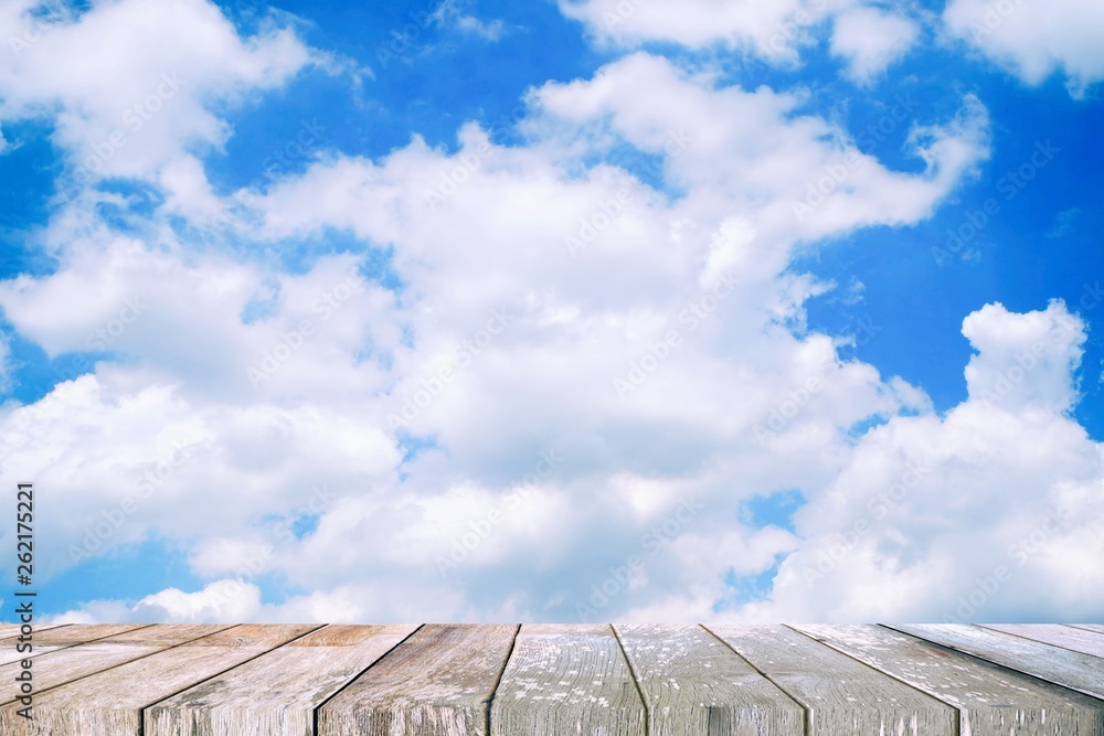 Empty Wooden Table with White Clouds and Blue Sky Background, Suitable for Presentation, Web Temple, Backdrop, and Product Display. Empty Wooden Table with White Clouds and Blue Sky Background, Suitable for Presentation, Web Temple, Backdrop, and Product Display.