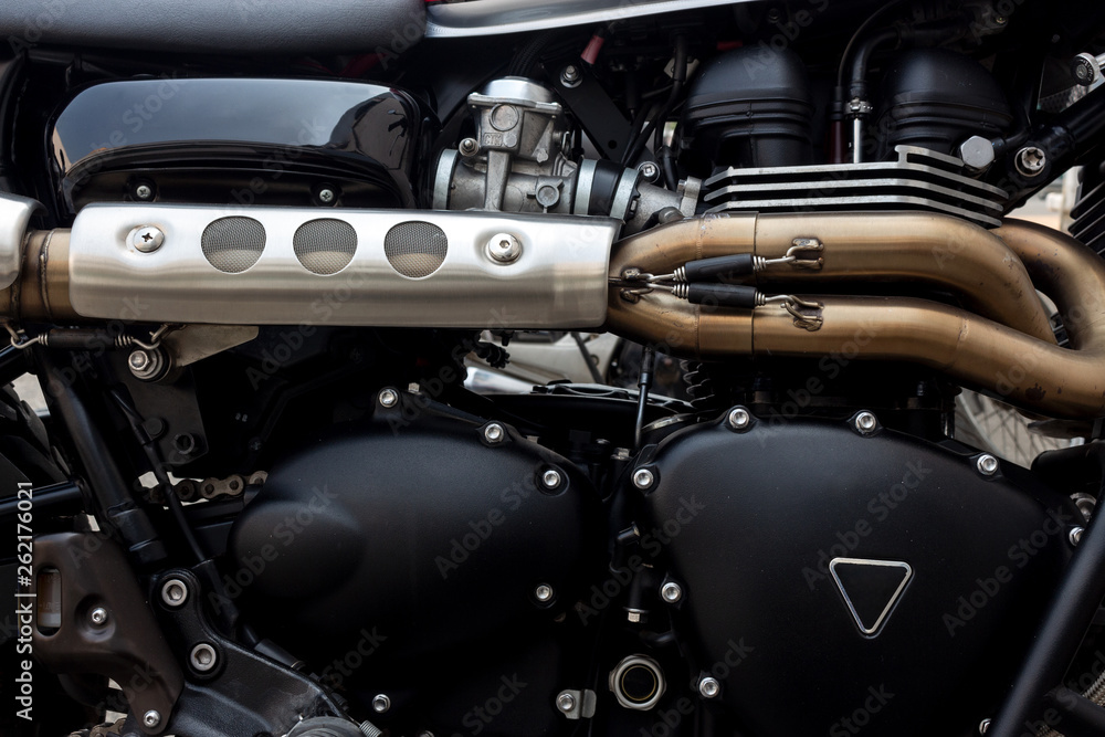 Fototapeta premium closeup motorcycle engine with soft-focus and over light in the background