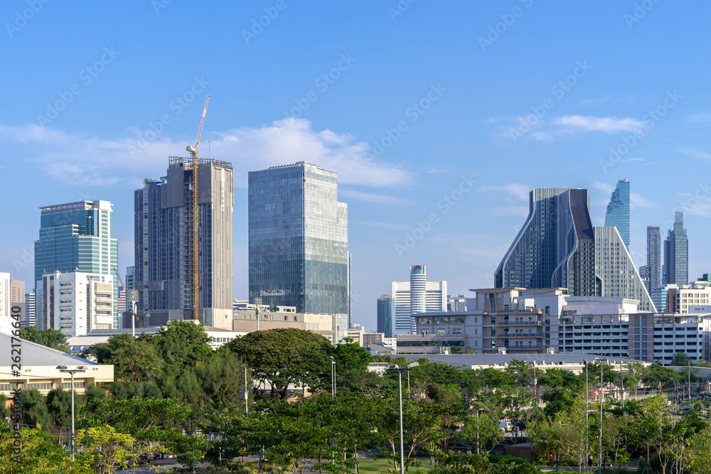 Fototapeta premium aerial view Bangkok city urban downtown skyline modern office buildings and condominium tower on blue sky background , City scape Bangkok City Thailand