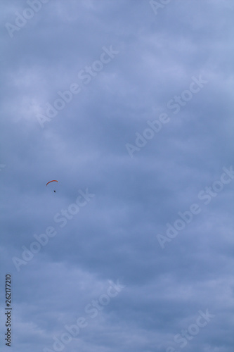 kite flying in the sky,flying, paraglider, parachute, paragliding, sport,clouds, extreme, adventure, air, flight,freedom, glider, gliding, cloud, skydiving,activity, wind,