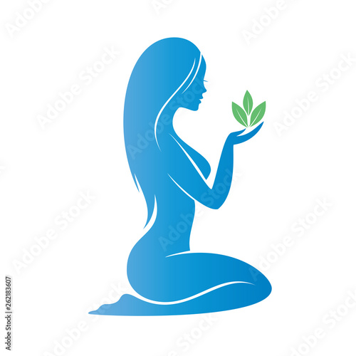 beautiful woman holding a plant ina a palm, heath care concept