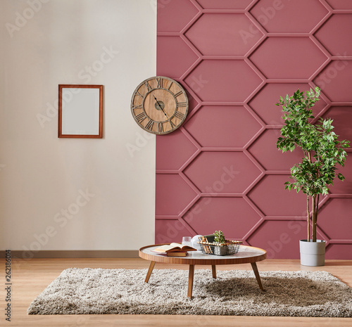 white and claret red wall concept, wooden clock middle table and vae of plant. photo